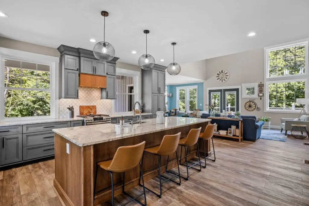 Interior design of a beautiful kitchen with a large island in a modern new England colonial home